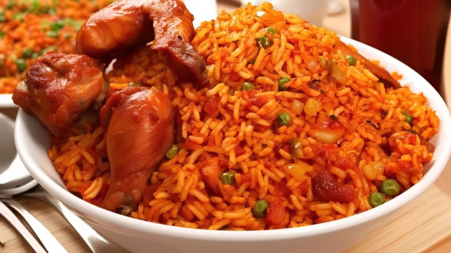 A generous bowl of jollof rice served with chicken