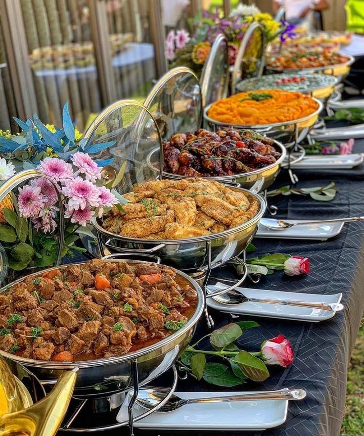 An outdoor buffet prepared by The Promise